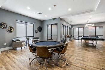 Resident social lounge featuring a game table, billiards, full kitchen, and 6 flat screen tvs